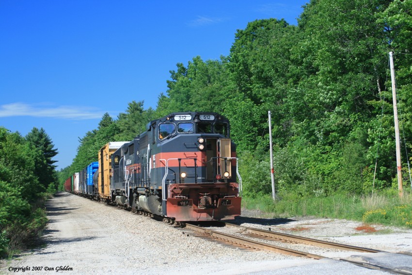 Photo of MEC 512 approaching a crossing