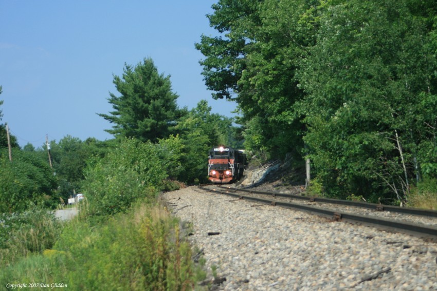 Photo of B&M 334 passing a cut in the rock