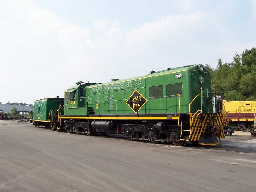 Photo of SMS 554 and transfer caboose
