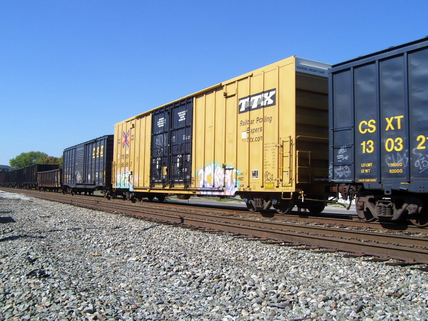 Photo of One of many TTX high-cubed boxcars on the Q303.