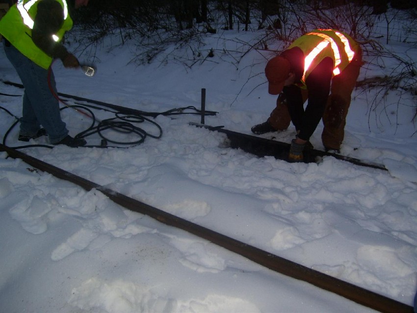 Photo of CMRR Track Crew Replacing Bolts at MP 27.3