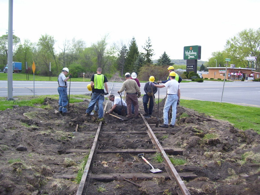 Photo of Tamping the last Tie at Washington Avenue