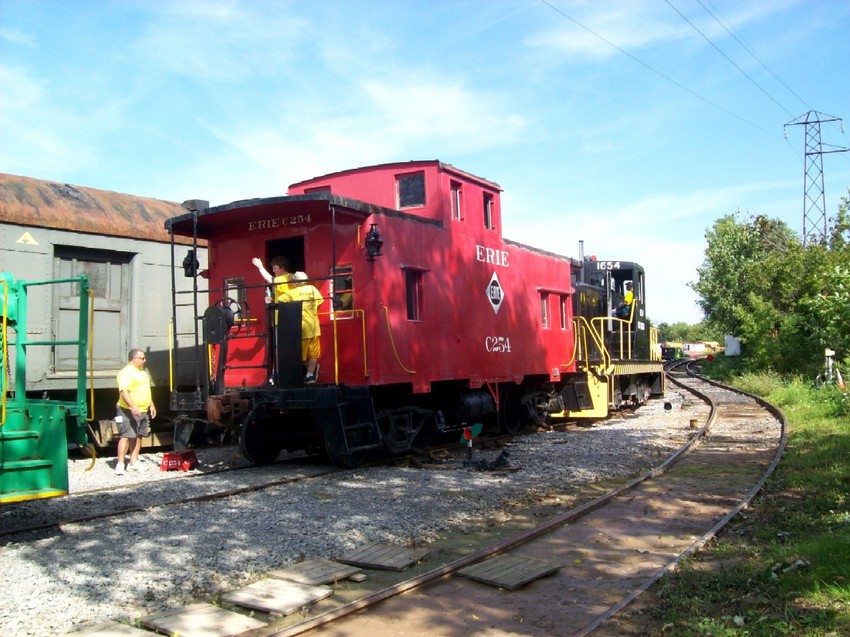Photo of An ex-erie caboose and RG&V 1654 head to the trolley ride to NYMT in Industry ny