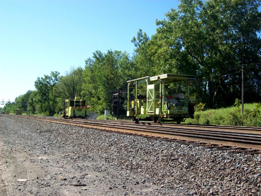 Photo of A huge parade of M.O.W equip. prepares to tie down on a siding east of CP 382.