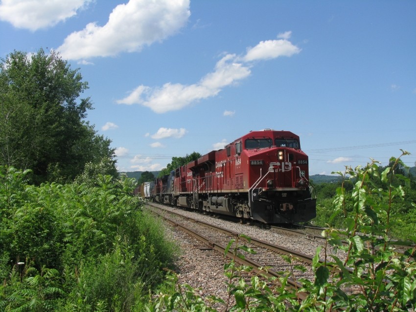 Photo of CP 8854 leads a SB past Shaw Rd