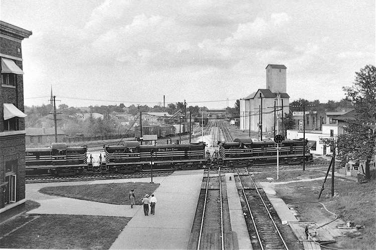 Photo of Nickel Plate RS3 Units Crossing GM&O, Bloomington, Illinois, 1954