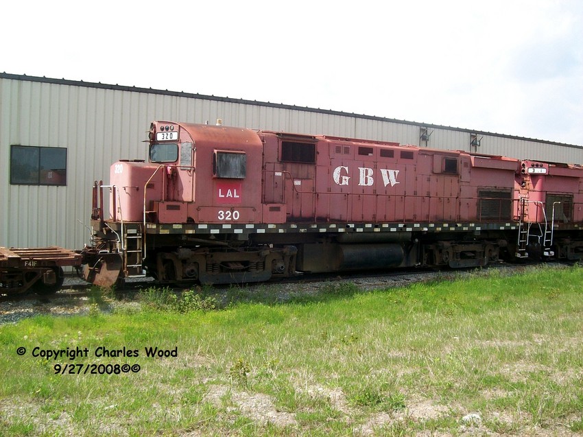 Photo of 1/2 of LA&Ls ex-GBW parts C424s sit outside the Lakeville ny engine house.