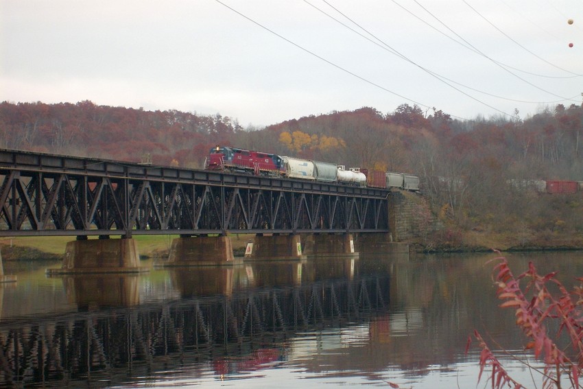 Photo of A set of HCLX SD40M-3s (?) sit with a train up top the Stillwater ny viaduct.