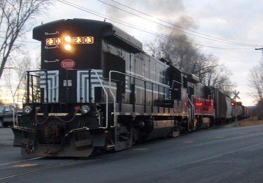 Photo of Two Finger Lakes Railway B23-7s switch Geneva ny yard on a cloudy evening.