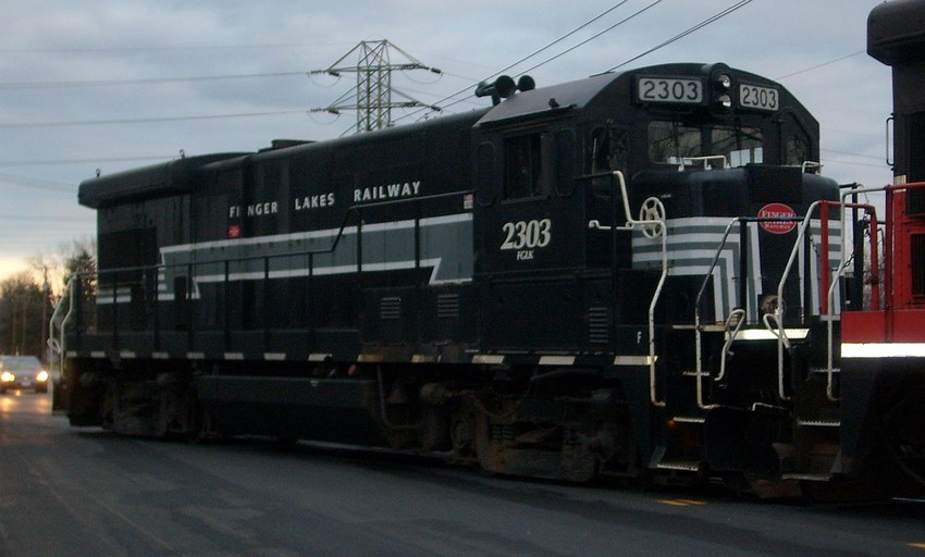 Photo of Two Finger Lakes Railway B23-7s switch Geneva ny yard on a cloudy evening.