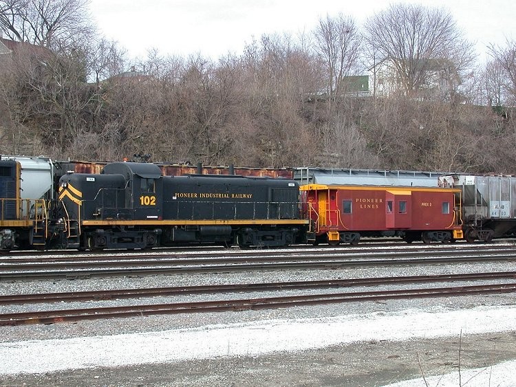 Photo of Pioneer Industrial Railway Alco RS3 and PREX Caboose, Keokuk, Iowa, March 2006