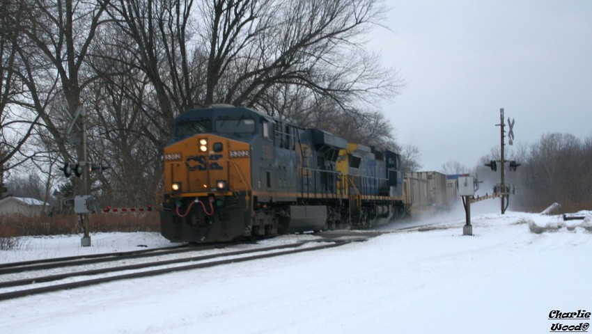 Photo of An EB Intermodal kicks up snow as it rolls into Churchville ny on a cold day.