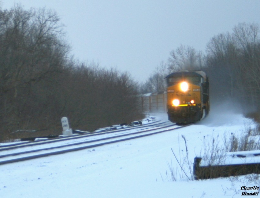 Photo of An EB Auto kicks up snow as it rolls into Churchville ny on a cold day.