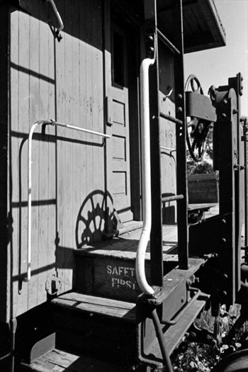 Photo of Caboose with shadows, Peace Dale Yard, NPRR, 1974