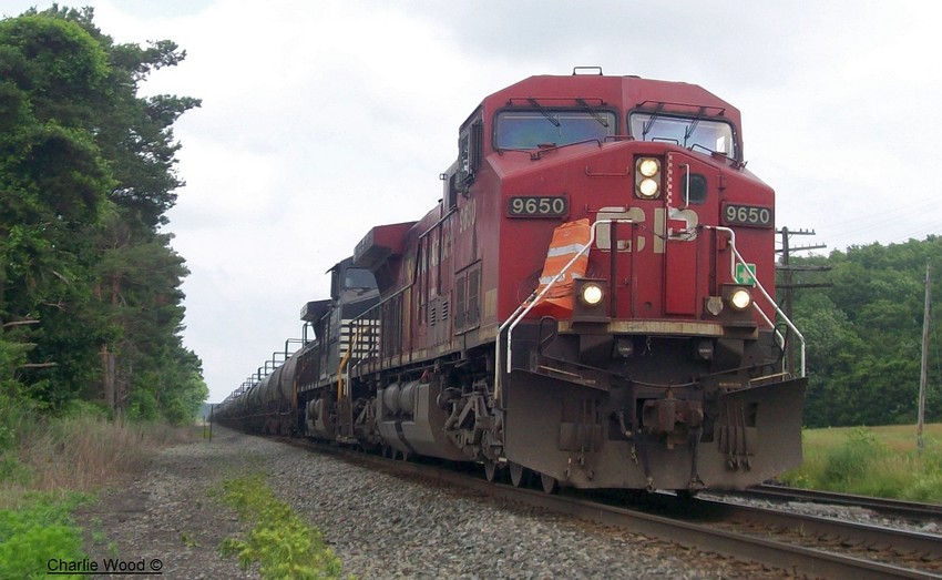 Photo of An WB CP train on NS Haulage rights carrying tanks rolls into Darien Ctr. ny.