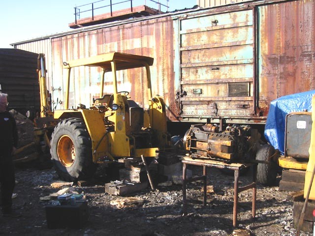 Photo of Old Backhoe. Engine removed for crank work.