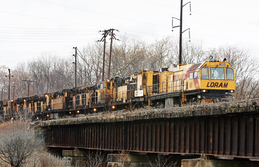 Photo of Loram rail grinder on Concord River Bridge in Lowell, MA