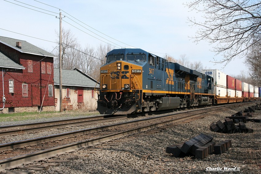 Photo of A CSX WB Intermodal does 60 into Churchville ny past the antique shop.
