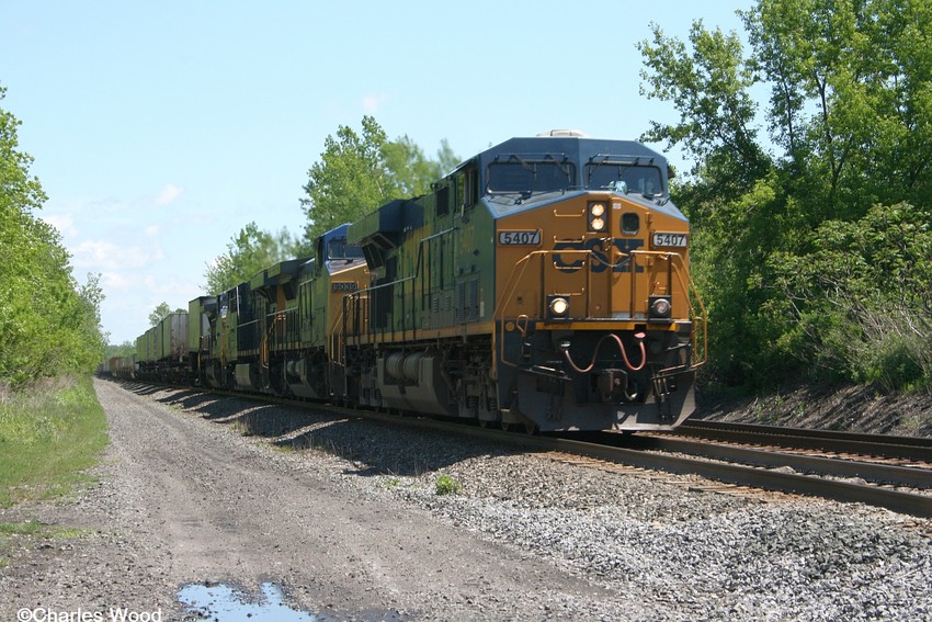 Photo of CSXT 5407 leads a WB intermodal behind 4 CSX engines at Snipery rd in Corfu ny.