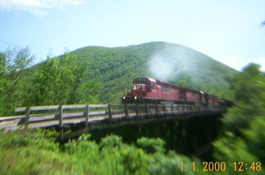 Photo of panam train edmo crossing the deerfield river westbound