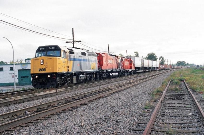 Photo of Via on the lead of CP Freight Train