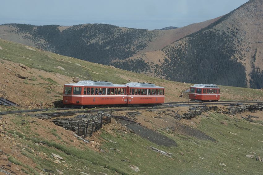 Photo of Two Pikes Peak trains pass on their way up/down the mountain.