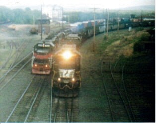 Photo of two trains leaving eastdeerfield yard ns empty coal train and edrj