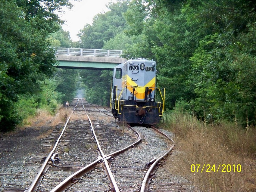 Photo of BLCR GP9 1701 on the Millis Industrial Line.