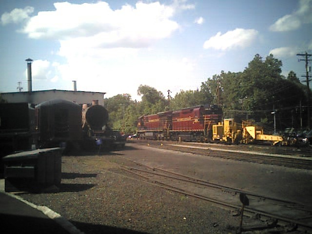 Photo of A scene of the NH&I yard with two unidentified engines in the distance