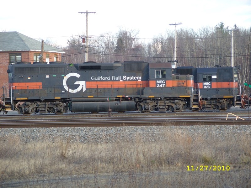 Photo of MEC#347w and MEC#373w are GP40's and tied down on diff tracks.