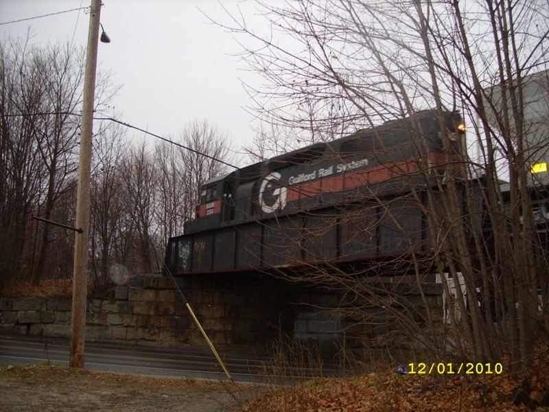 Photo of B&M#334 PO1 on the Bridge Street Bridge in Cumberland Mills.