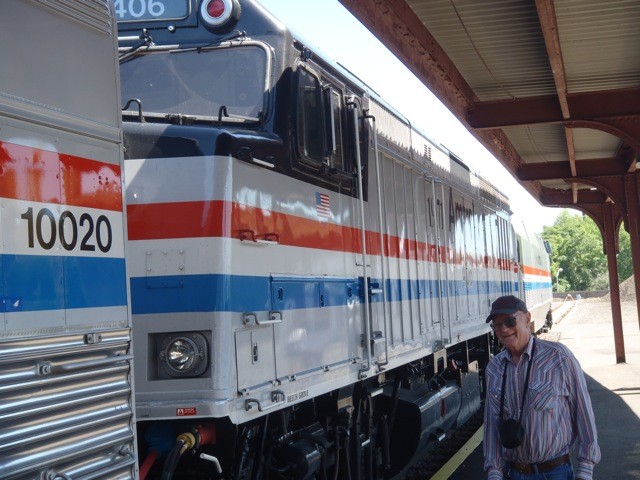 Photo of Amtrak retiree with Amtrak 40th ann. train