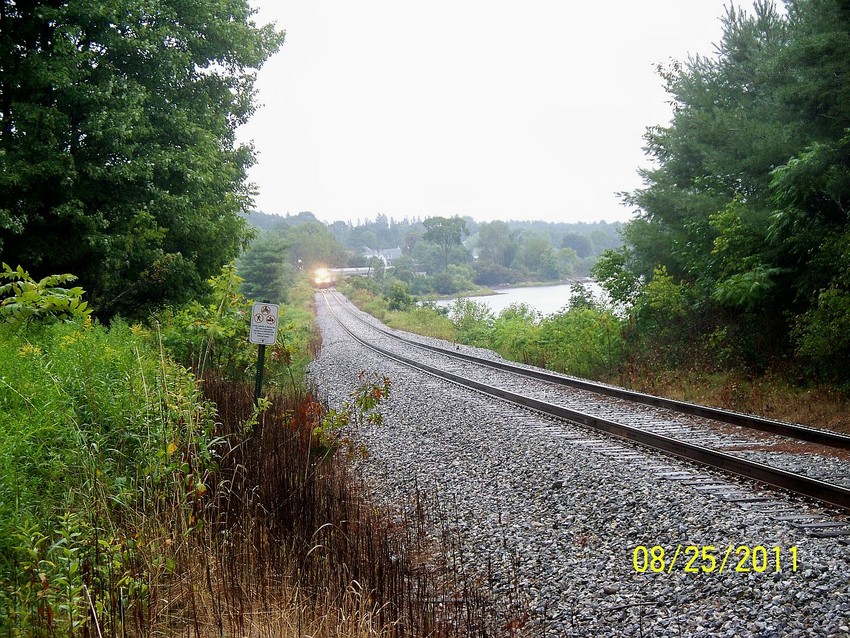 Photo of MER excursion train rounds the bend in Nobleboro, ME.