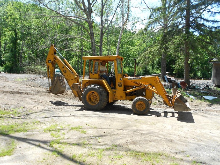 Photo of CMRR Backhoe Cleaning up Phoenicia Yard