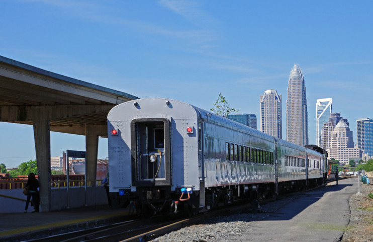 Photo of train #73 with downtown Charlotte in the background