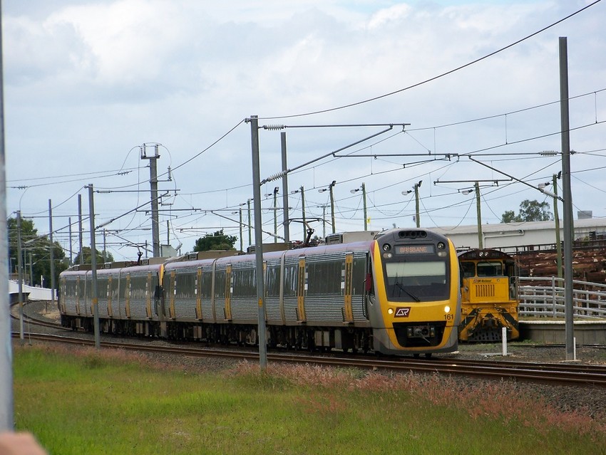 Photo of QR IMU-161 Passes Trough Holmview On An Express To Brisbane Airport Service.