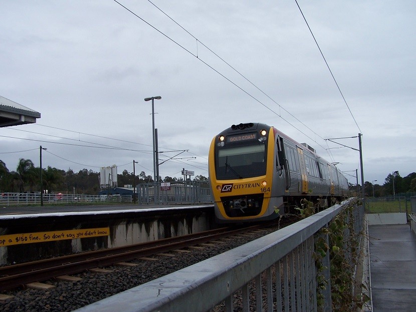 Photo of QR IMU-113 Seen Passing Through On Its Gold Coast Express