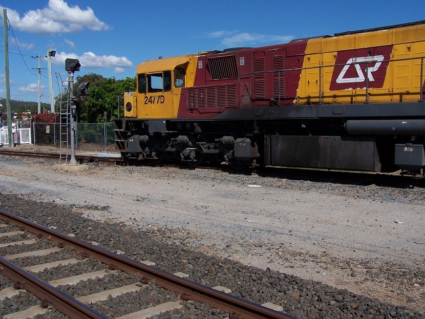 Photo of QR/AURIZON 2477 Preparing To Runaround Its Train.