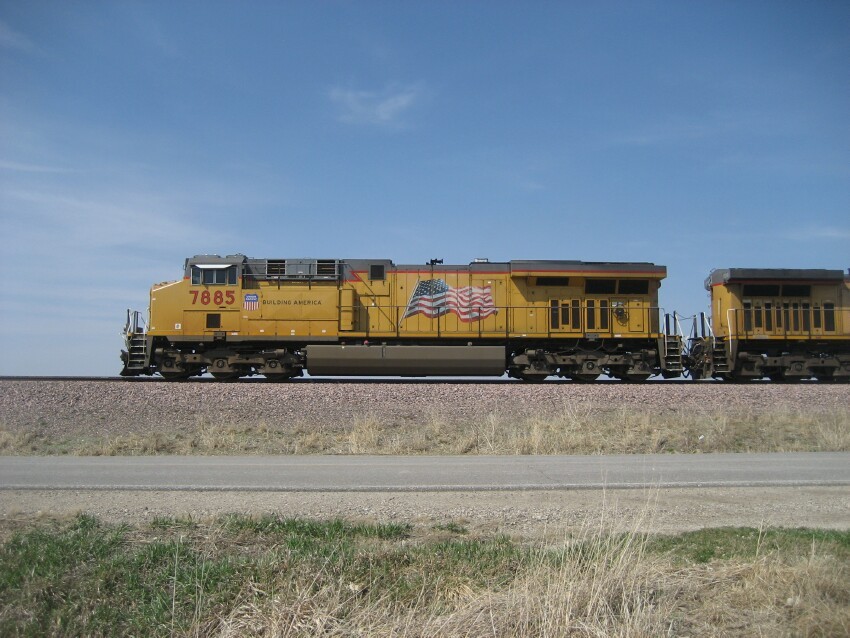 Photo of UP7885 Passing the Lincoln Highway Park along HWY 30