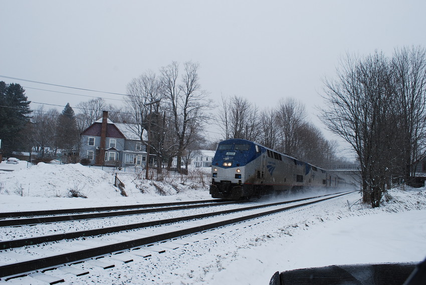 Photo of amtrak p448 @ mp142 with snow on the first day of spring