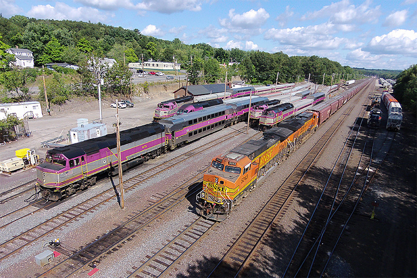 Photo of BNSF #8243 & 7869 on empty grain train at Fitchburg