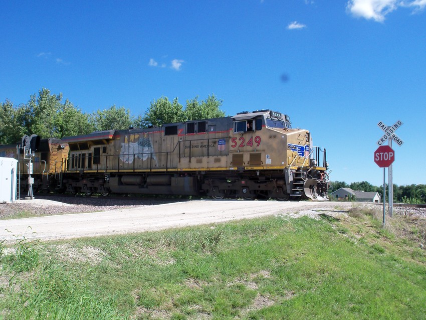 Photo of A UP Mixed Freight Passing a Grade Crossing