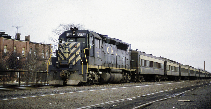 Photo of CNJ 3671 Shoves Commuter Train East out of Bound Brook, NJ