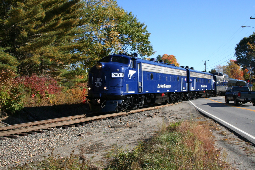 Photo of Comapany Passenger train crossing road just east of Oakland, Maine