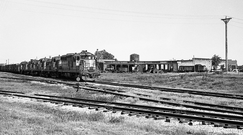 Photo of C&NW Eastbound Freight Passing Huron, SD Roundhouse