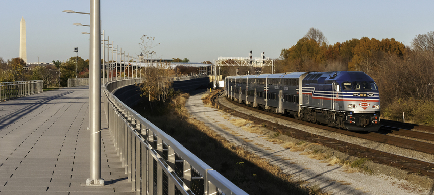 Photo of VRE V64 Leading Train 305 Past Long Bridge Park