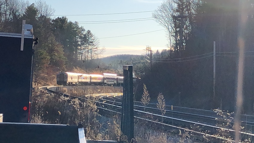 Photo of There goes the commuter rail in the distance arriving at the Wachusett station