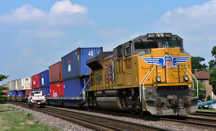 Photo of Hi-Rail truck races wb container train