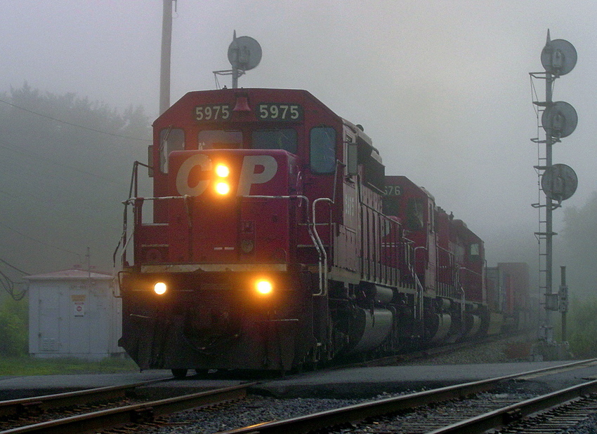 Photo of CP 164 emerges from the fog at Delanson