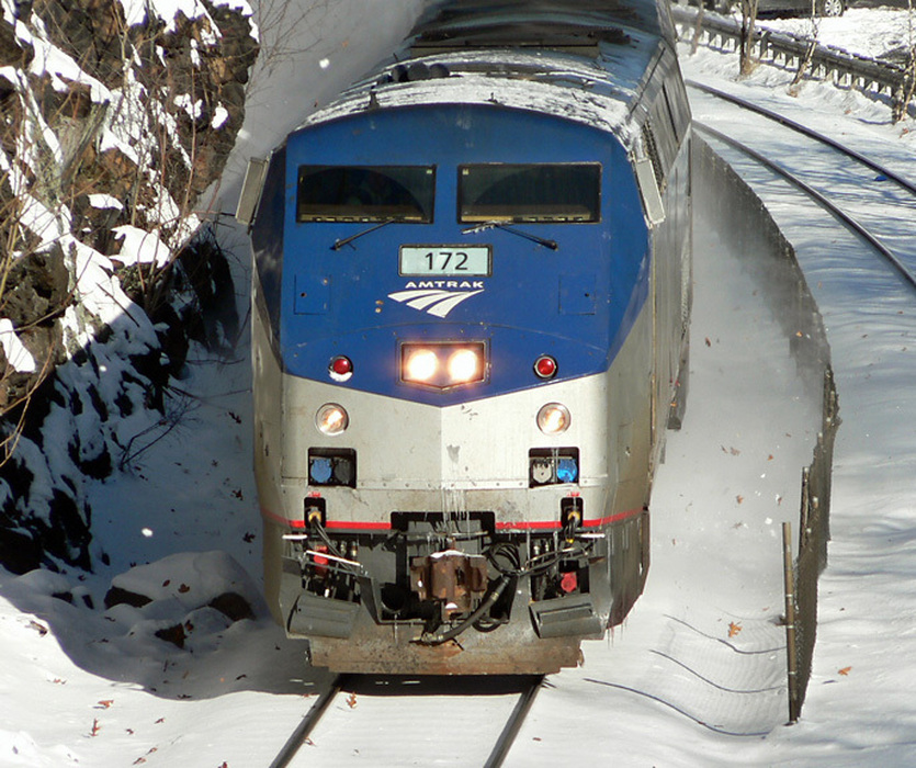 Photo of Amtrak 449 kicks up the snow at Wellesley Hills